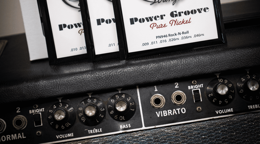 Electric guitar and amplifier with the title How to Improve Your Guitar Tone